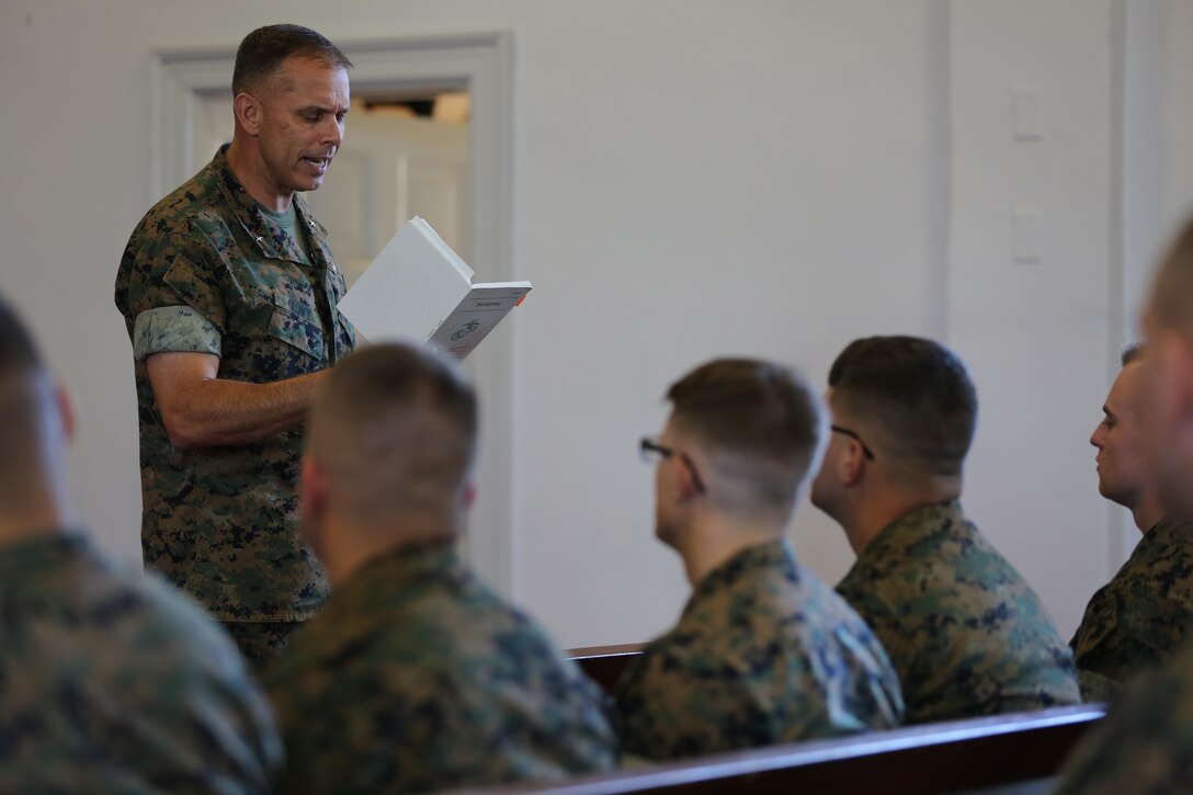 Brig. Gen. Matthew Glavy reads an excerpt from Marine Corps Doctrinal Publication 1-Warfighting to the Marines graduating from the Squadron Intelligence Training Certificate Course aboard Marine Corps Air Station Cherry Point, N.C., Oct. 21, 2016. The course was designed for intelligence Marines to give them a more in-depth look at how to operate in their job field aboard air stations in the Marine Corps.  “Your job is not always about doing things right; it’s also about doing the right thing,” said Glavy. “You can do something to the best of your ability, but is it ultimately in the best interest of achieving our goals? That is why this course is in place; to ensure that we do the right things, for the right reasons.” (U.S. Marine Corps photo by Lance Cpl. Mackenzie Gibson/Released)