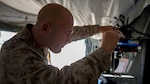 U.S. Marine Corps Chief Warrant Officer 2 Mathew Wright, a motor transportation maintenance officer with Marine Wing Support Squadron 372, conducts maintenance on an Invent3D printer during a 3-D printer integration exercise at site 50 training area, Wellton, Arizona, Oct. 18, 2016. Wright used the additive manufacturing equipment to make objects from 3-D model data throughout Weapons Tactics Instructors course 1-17.  Marine Aviation Weapons and Tactics Squadron One cadre host WTI which emphasizes operational integration of the six functions of Marine Corps aviation in support of a Marine Air Ground Task Force. MAWTS-1 provides standardized advanced tactical training and certification of unit instructor qualifications to support Marine aviation Training and Readiness and assists in developing and employing aviation weapons and tactics. 