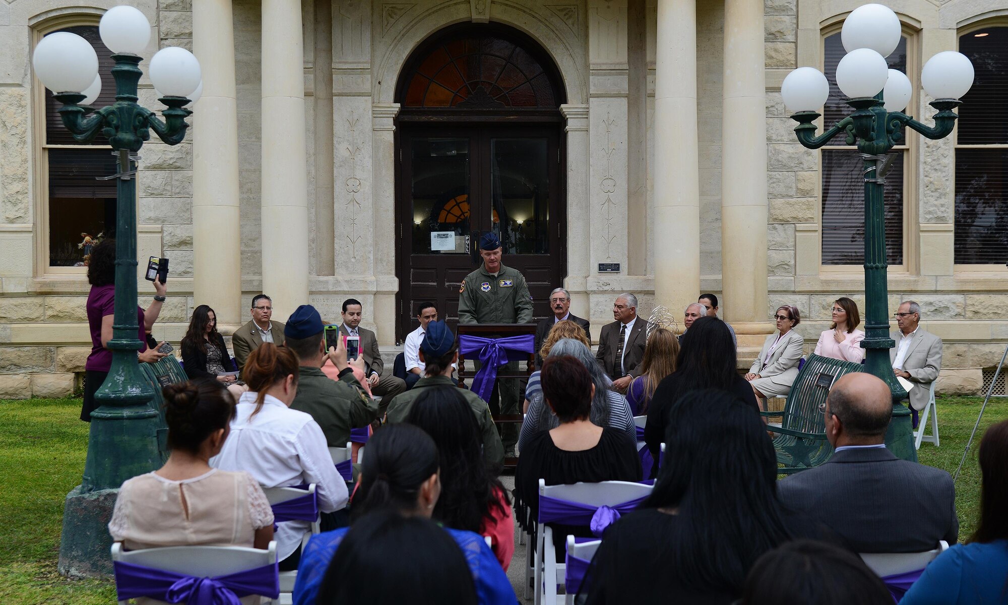 Col. Thomas Shank, 47th Flying Training Wing commander, speaks to a crowd at the Val Verde County Courthouse in Del Rio, Texas, Oct. 13, 2016. This event launched the Val Verde County Sexual Assault Response Team, which will allow victims to receive all initial care and response in Del Rio instead of having to seek aid San Antonio, Texas. (U.S. Air Force photo/Senior Airman Ariel D. Partlow)