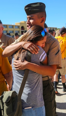 A Marine from Echo Company, 2nd Recruit Training Battalion, hugs his loved one after being released for liberty at Marine Corps Recruit Depot San Diego, Oct. 20. This is the first time they have seen their Marines since they arrived at the depot 13 weeks ago. Annually, more than 17,000 males recruited from the Western Recruiting Region are trained at MCRD San Diego. Echo Company is scheduled to graduate Oct. 21.