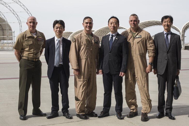 From left to right, U.S. Marine Corps Col. Richard Fuerst, commanding officer of Marine Corps Air Station (MCAS) Iwakuni, Japan, Kosei Nomura, director of Status of U.S. Forces Agreement Division Ministry of Foreign Affairs of Japan, Lt. Col. J. T. Bardo, commanding officer of Marine Fighter Attack Sqaudron (VMFA) 121, Yoshihiko Fukuda, mayor of Iwakuni City, Japan, Col. Marcus Annibale, commanding officer of Marine Aircraft Group (MAG) 13, and Takahiro Sugawara, director general of Chugoku-Shikoku Defense Bureau Japan Ministry of Defense, pose for a group photo at MCAS Yuma, Oct. 24, 2016. This event gave Fukuda an idea of what to expect of the aircraft following the scheduled basing of VMFA 121 at MCAS Iwakuni. After its transition, VMFA-121 will be the first F-35B squadron stationed in Japan.(U.S. Marine Corps phot by Cpl. Nathan Wicks)