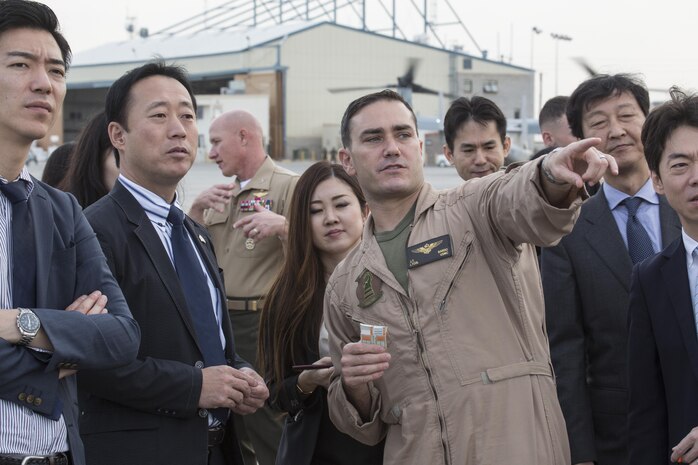 Yoshihiko Fukuda, mayor of Iwakuni City, Japan, and U.S. Marine Corps Lt. Col. J. T. Bardo, commanding officer of Marine Fighter Attack Squadron (VMFA) 121, observe an F-35B Lightning II at Marine Corps Air Station (MCAS) Yuma, Arizona, Oct. 24, 2016. The demonstration of the F-35B gave Fukuda a better understanding of the aircraft and its capabilities. This event helped Fukuda better understand the capabilities of VMFA 121.(U.S. Marine Corps photo by Cpl. Nathan Wicks)