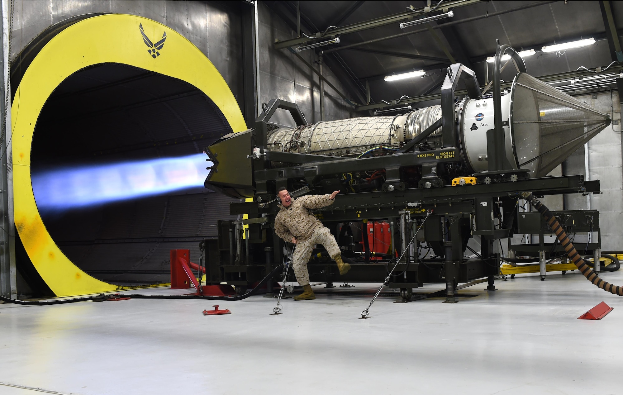 Marine Corps Sgt. Maj. Anthony Spadaro, U.S. Pacific Command senior enlisted leader, holds on as a Pratt and Whitney F119 engine performs an engine run at Joint Base Elmendorf-Richardson, Alaska, Oct. 21, 2016. Spadaro, a native of New Brunswick, New Jersey visited JBER for a three day immersion tour Oct. 19 to 21, 2016. Spadaro provides the PACOM commander with the enlisted perspective on theater security cooperation, encouraging peaceful development, responding to contingencies, and deterring aggression throughout the Indo-Asia-Pacific region. This was his first visit to Alaska. 