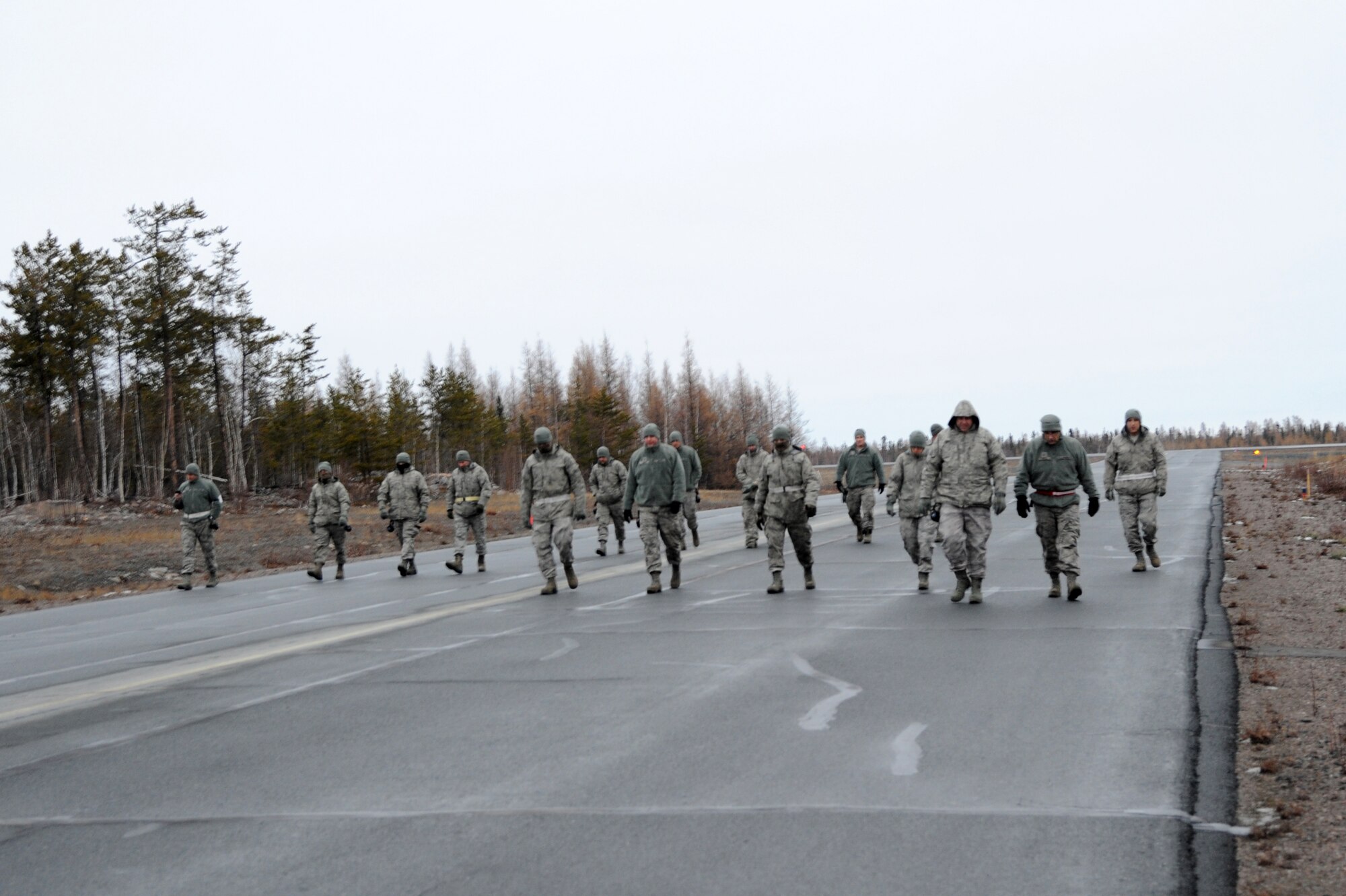 Members of 142nd Maintenance Group check the taxiway for debris, in preparation for the return of the F-15 Eagles supporting Exercise Vigilant Shield 2017, Yellowknife, Northwest Territories, Oct. 20, 2016.  During this exercise, forces supporting North American Aerospace Defense Command (NORAD) will deploy and conduct air sovereignty operations in the far north and the high Arctic demonstrating the ability to detect, identify and meet possible threats in some of the most remote regions in the world.  (U.S. Air National Guard photo by Senior Master Sgt. Shelly Davison, 142nd Fighter Wing Public Affairs). 