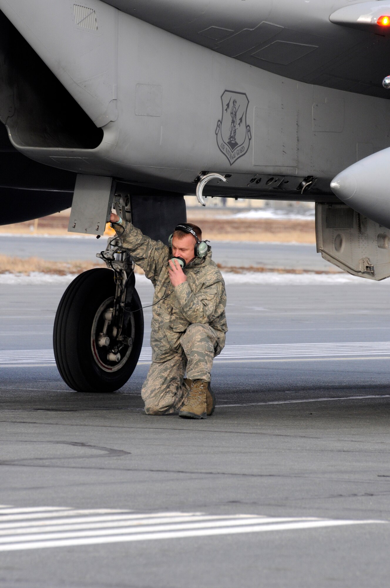 Technical Sgt. Michael Banks, 142nd Maintenance Group, talks to pilot Lt. Col. William Kopp, following an aircraft arresting barrier system test at the Yellowknife, Northwest Territories, Airport, Oct. 18, 2016.  The arresting barrier system is used in the event of an emergency where a fighter aircraft cannot stop on its own.  Members of the 142nd Fighter Wing are in Yellowknife to participate in Vigilant Shield 2017. The Vigilant Shield 2017 Field Training Exercise is an annual exercise sponsored by The North American Aerospace Defense Command and led by Alaskan NORAD Region, in conjunction with Canadian NORAD Region and Continental NORAD Region, who undertake field training exercises aimed at improving operational capability in a bi-national environment.   (U.S. Air National Guard photo by Senior Master Sgt. Shelly Davison, 142nd Fighter Wing Public Affairs)