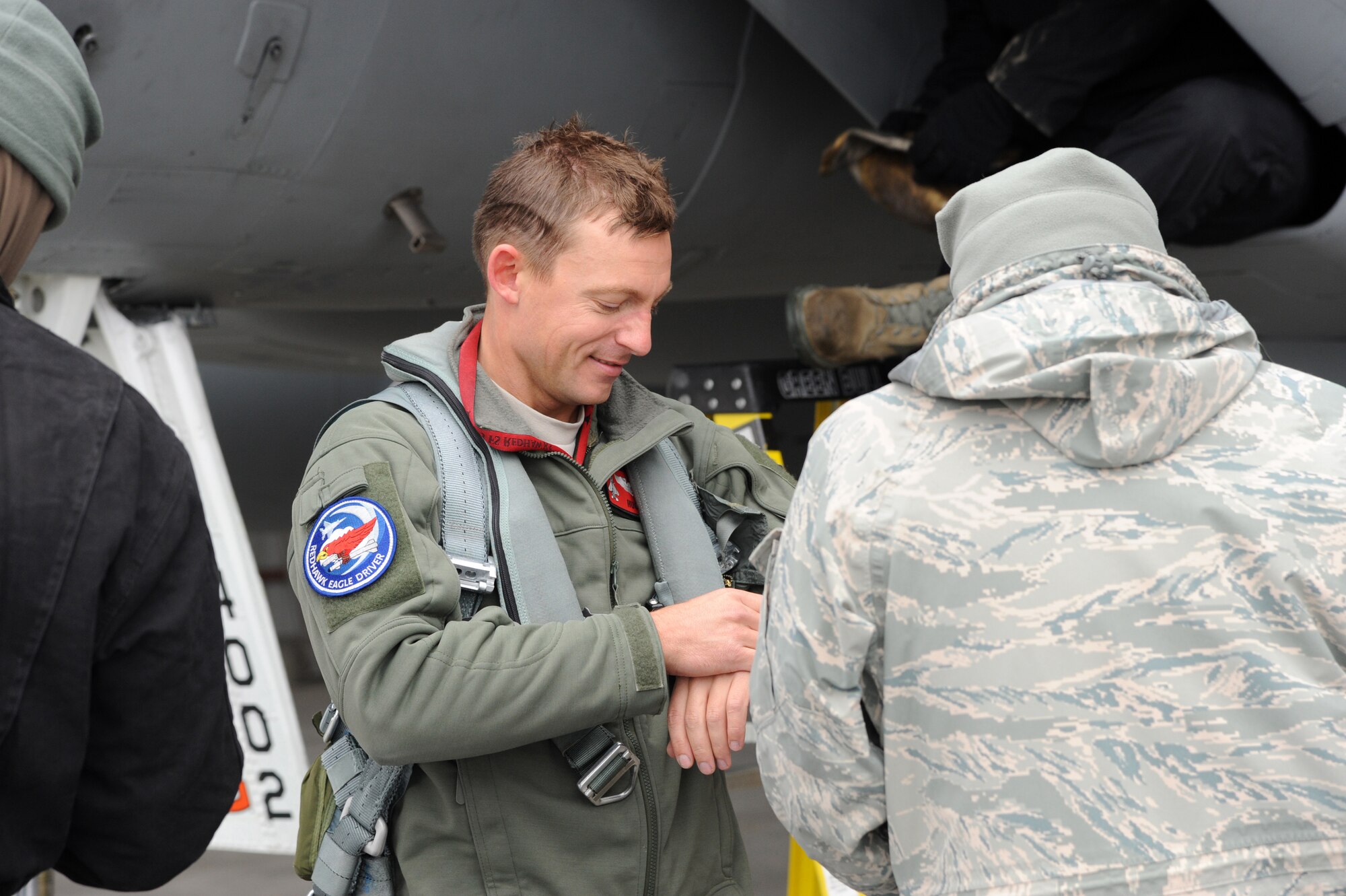 Capt. James Hastings, 123rd Fighter Squadron, is greeted as he arrives in Yellowknife, Northwest Territories, for Exercise Vigilant Shield 2017, Oct. 17, 2016. During this exercise, forces supporting North American Aerospace Defense Command (NORAD) will deploy and conduct air sovereignty operations in the far north and the high Arctic demonstrating the ability to detect, identify and meet possible threats in some of the most remote regions in the world.  (U.S. Air National Guard photo by Senior Master Sgt. Shelly Davison, 142nd Fighter Wing Public Affairs).  