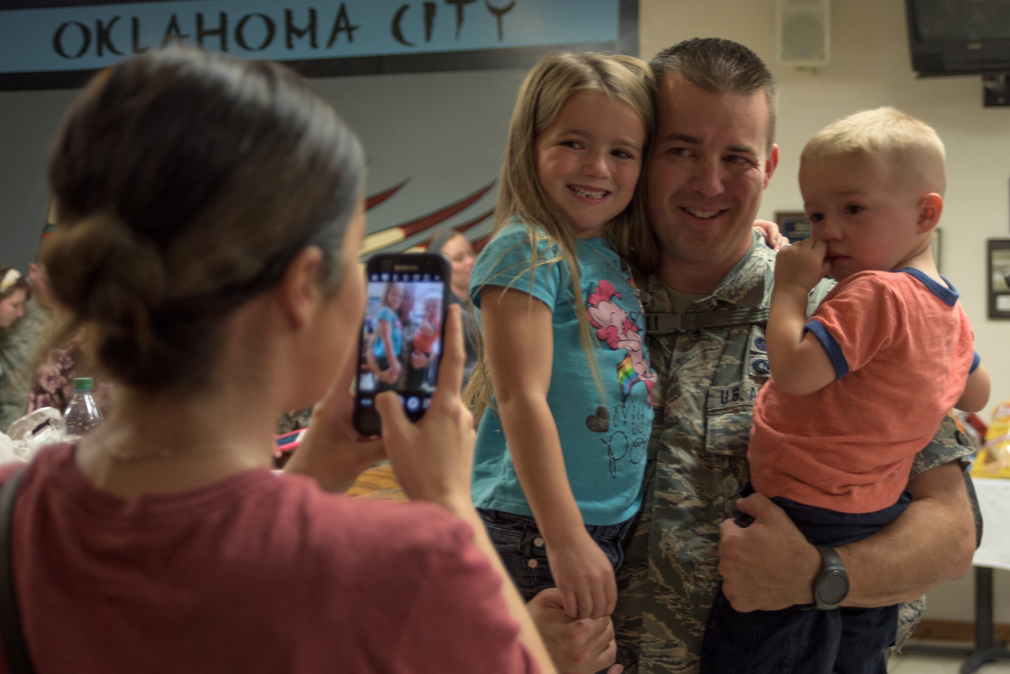 Tech. Sgt. Stephen Strong assigned to the 137th Special Operations Force Support Squadron, poses for a photo with his children prior to deploying in support of Operation Freedom's Sentinel, Will Rogers Air National Guard Base, October 19, 2016. Strong is one of over 140 Airmen who will deploy from WRANGB to Southwest Asia, the first major deployment for the 137 SOW as a special operations wing. (U.S. Air National Guard photo by Tech. Sgt. Caroline Essex)