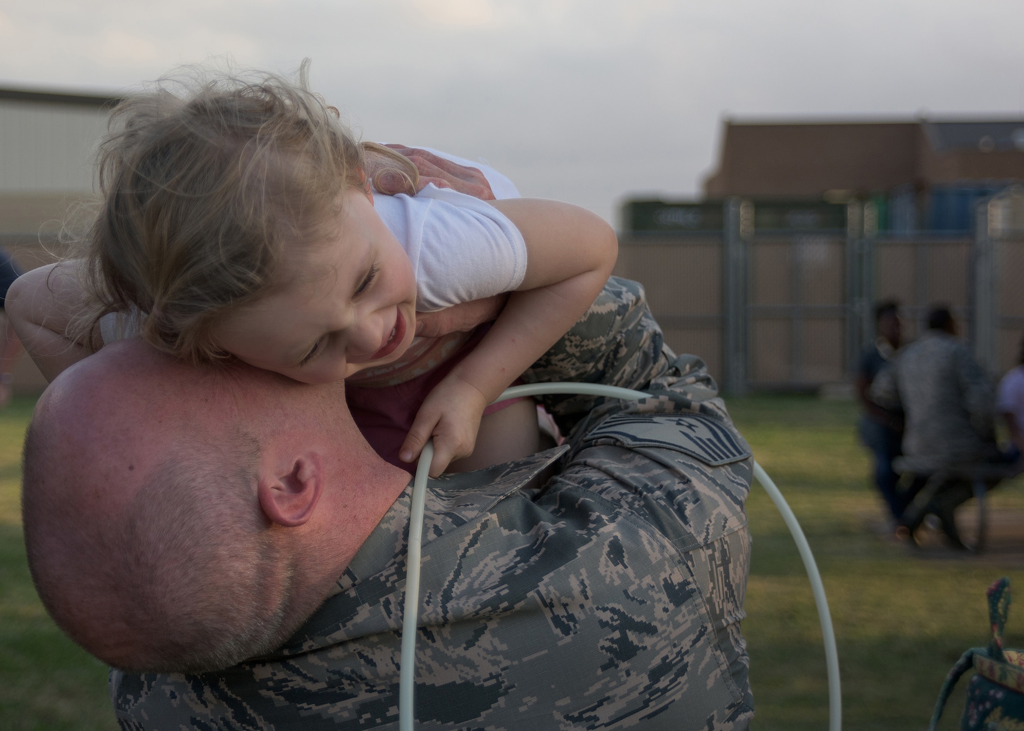 Air Force Master Sgt. Michael Rigsby assigned to the 137th Special Operations Civil Engineering Squadron, spends time with his daughter prior to deploying from Will Rogers Air National Guard Base, October 19, 2016. Rigsby is one of over 140 Airmen who will deploy from WRANGB in support of Operation Freedom's Sentinel in Southwest Asia, the first major deployment for the 137 SOW as a special operations wing. (U.S. Air National Guard photo by Tech. Sgt. Caroline Essex)