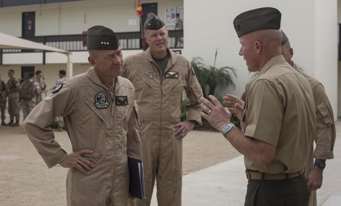 From left to right, U.S. Marine Corps Lt. Gen. Jon Davis, deputy commandant for aviation, Maj. Gen. Mark Wise, 3rd Marine Aircraft Wing (MAW) commanding general, are greeted by Col. Richard Fuerst, commanding officer of Marine Corps Air Station (MCAS) Iwakuni, Japan, at MCAS Yuma, Ariz. Oct. 24, 2016. This event gave Yoshihiko Fukuda, mayor of Iwakuni City, Japan, an idea of what to expect of the aircraft following the scheduled basing of Marine Fighter Attack Squadron (VMFA) 121 at MCAS Iwakuni. After its transition, VMFA-121 will be the first F-35B squadron stationed in Japan.(U.S. Marine Corps photo by 1st Lt. Melissa Heisterberg)