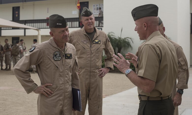 From left to right, U.S. Marine Corps Lt. Gen. Jon Davis, deputy commandant for aviation, Maj. Gen. Mark Wise, 3rd Marine Aircraft Wing (MAW) commanding general, are greeted by Col. Richard Fuerst, commanding officer of Marine Corps Air Station (MCAS) Iwakuni, Japan, at MCAS Yuma, Ariz. Oct. 24, 2016. This event gave Yoshihiko Fukuda, mayor of Iwakuni City, Japan, an idea of what to expect of the aircraft following the scheduled basing of Marine Fighter Attack Squadron (VMFA) 121 at MCAS Iwakuni. After its transition, VMFA-121 will be the first F-35B squadron stationed in Japan.(U.S. Marine Corps photo by 1st Lt. Melissa Heisterberg)