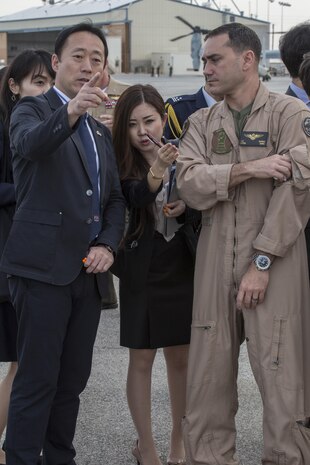 Yoshihiko Fukuda, mayor of Iwakuni City, Japan, and U.S. Marine Corps Lt. Col. J. T. Bordo, commanding officer of Marine Fighter attack Squadron (VMFA) 12 observes an F-35B Lightning II at Marine Corps Air Station (MCAS) Yuma, Arizona, Oct. 24, 2016. The demonstration of the F-35B gave Fukuda a better understanding of the aircraft and its capabilities. This event helped Fukuda better understand the capabilities of VMFA-121.(U.S. Marine Corps photo by Cpl. Nathan Wicks)

