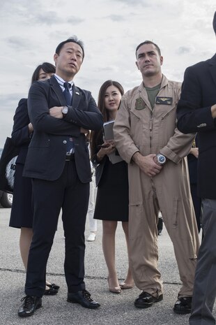 Yoshihiko Fukuda, mayor of Iwakuni City, Japan, and U.S. Marine Corps Lt. Col. J. T. Bordo, commanding officer of Marine Fighter attack Squadron (VMFA) 12 observes an F-35B Lightning II at Marine Corps Air Station (MCAS) Yuma, Arizona, Oct. 24, 2016. The demonstration of the F-35B gave Fukuda a better understanding of the aircraft and its capabilities. This event helped Fukuda better understand the capabilities of VMFA-121.(U.S. Marine Corps photo by Cpl. Nathan Wicks)
