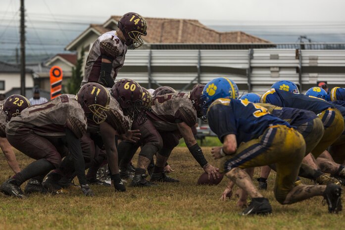 The Matthew C. Perry High School Samurai football team prepares to snap the football during the homecoming football game against the Yokota High School Panthers at Marine Corps Air Station Iwakuni, Japan, Oct. 22, 2016. Both undefeated in Division II Japan, the Samurai (5-1) faced off against the Panthers (4-1) where the winner became the Division II Japan champions. The Samurai, a power run oriented team, beat the Panthers 52-19 making them the Division II Japan champions. (U.S. Marine Corps photo by Lance Cpl. Aaron Henson)