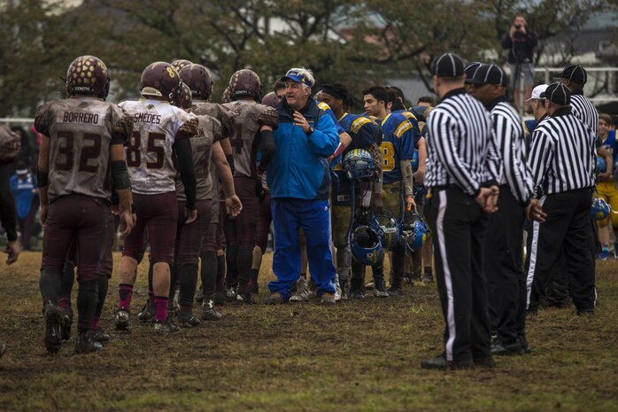 The Matthew C. Perry High School Samurai and Yokota High School Panthers football teams shake hands after the Division II Japan championship game at Marine Corps Air Station Iwakuni, Japan, Oct. 22, 2016. At the end of the fourth quarter, the Samurai beat the Panthers 52-19 making them the Division II Japan champions. The M.C. Perry Samurai will host the Humphreys High School Blackhawks from U.S. Army Garrison, Camp Humphreys, Korea, the Division II Korea champions during the Far East Division II Championship on Nov. 5, 2016. (U.S. Marine Corps photo by Lance Cpl. Aaron Henson)