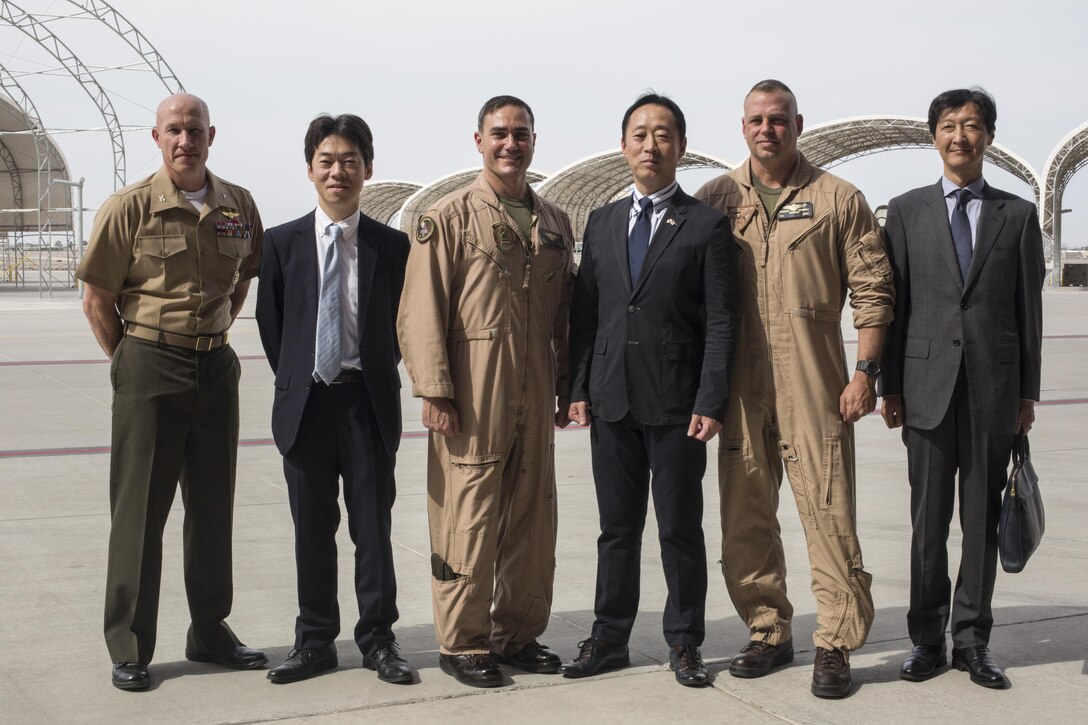 From left to right, U.S. Marine Corps Col. Richard Fuerst, commanding officer of Marine Corps Air Station (MCAS) Iwakuni, Japan, Kosei Nomura, director of Status of U.S. Forces Agreement Division Ministry of Foreign Affairs of Japan, Lt. Col. J. T. Bardo, commanding officer of Marine Fighter Attack Sqaudron (VMFA) 121, Yoshihiko Fukuda, mayor of Iwakuni City, Japan, Col. Marcus Annibale, commanding officer of Marine Aircraft Group (MAG) 13, and Takahiro Sugawara, director general of Chugoku-Shikoku Defense Bureau Japan Ministry of Defense, pose for a group photo at MCAS Yuma, Oct. 24, 2016. This event gave Fukuda an idea of what to expect of the aircraft following the scheduled basing of Marine Fighter Attack Squadron (VMFA) 121 at MCAS Iwakuni. After its transition, VMFA-121 will be the first F-35B squadron stationed in Japan.(U.S. Marine Corps phot by Cpl. Nathan Wicks)