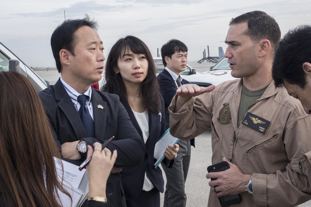 Yoshihiko Fukuda, mayor of Iwakuni City, Japan, and U.S. Marine Corps Lt. Col. J. T. Bordo, commanding officer of Marine Fighter attack Squadron (VMFA) 12 observes an F-35B Lightning II at Marine Corps Air Station (MCAS) Yuma, Arizona, Oct. 24, 2016. The demonstration of the F-35B gave Fukuda a better understanding of the aircraft and its capabilities. This event helped Fukuda better understand the capabilities of VMFA-121.(U.S. Marine Corps photo by Cpl. Nathan Wicks)
