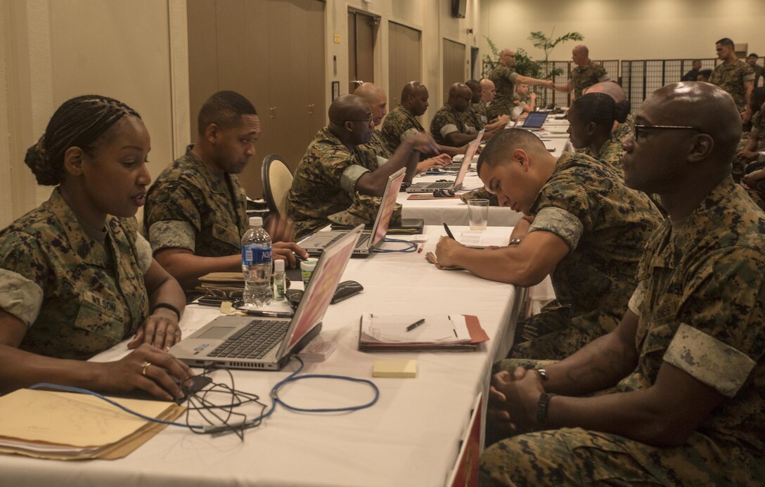 The monitors from Manpower Management Division Enlisted Assignments are conducting an annual visit to Okinawa, Japan, during the week of October 25, 2016. By doing this monitors are able to sit down face-to-face with the Marines and discuss their future options. As a monitor they are responsible for conducting interviews with Marines to ensure they are stationed in positions where they have a better chance to grow individually and professionally. (U.S. Marine Corps photo by Cpl. Jessica Etheridge / Released)