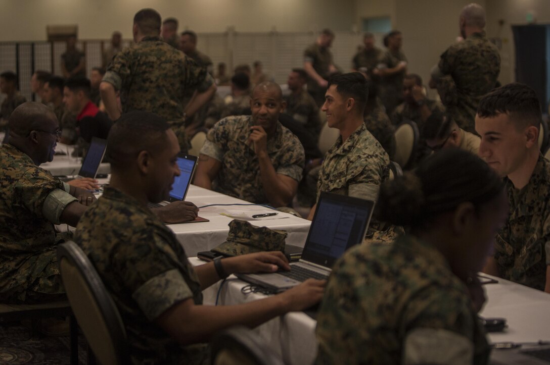Cpl. Randy G. Thomas sits down with Master Gunnery Sgt. Eric Ingram to discuss his future Marine Corps path on Camp Kinser, Okinawa, Japan, October 25, 2016. Ingram is a motor transport monitor for Manpower Management Division Enlisted Assignments, Headquarters United States Marine Corps. As a monitor Ingram is responsible for conducting interviews with Marines to ensure they are stationed in positions where they have a better chance to grow individually and professionally. Thomas is a motor transport operator for Combat Logistics Regiment 3, 3rd Marine Logistics Group, III Marine Expeditionary Force. (U.S. Marine Corps photo by Cpl. Jessica Etheridge /Released)