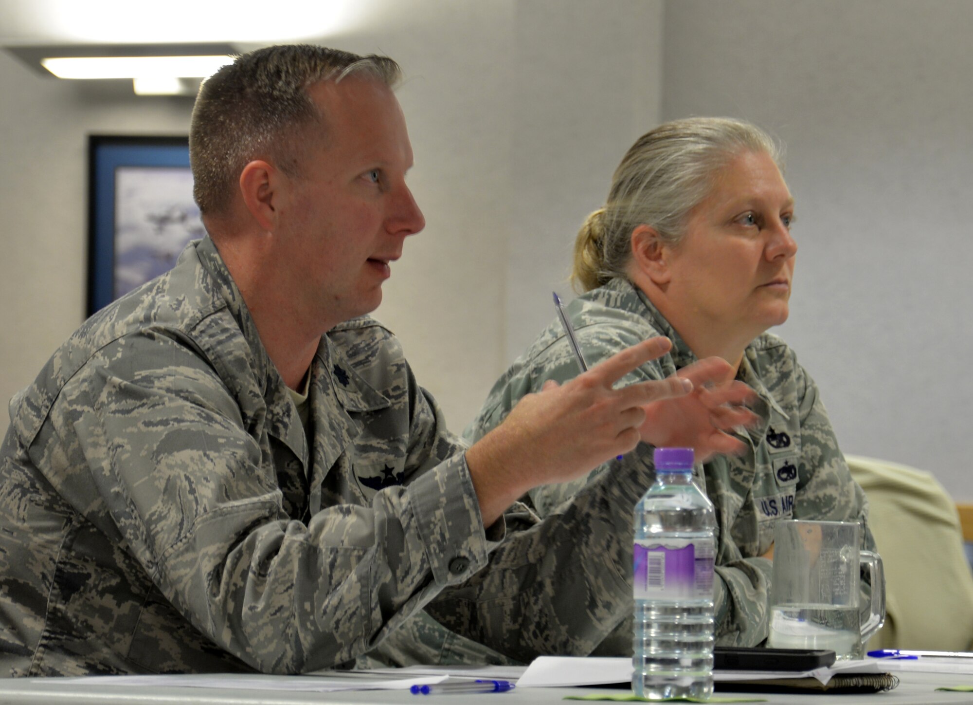 U.S. Air Force Lt. Col. Benjamin Carroll, 100th Operations Support Squadron director of operations, and U.S. Air Force Lt. Col. Jennifer Neris, 100th Logistics Readiness Squadron commander, give their feedback during a professional development class Oct. 19, 2016, on RAF Mildenhall, England. Leadership took time to hear their Airmen’s ideas, and then shared their thoughts. (U.S. Air Force photo by Gina Randall)