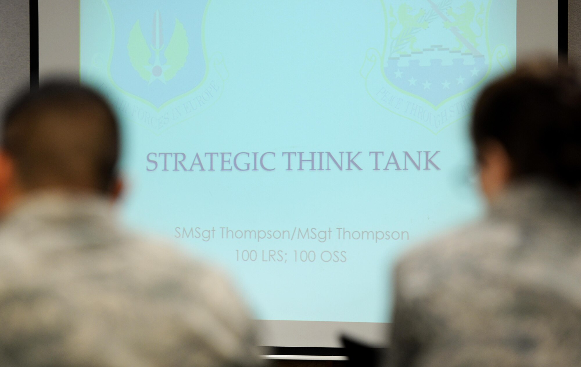 U.S. Air Force Airmen watch slides as part of a professional development class Oct. 19, 2016, on RAF Mildenhall, England. Airmen from across RAF Mildenhall and RAF Lakenheath came together to be able to identify problems and identify ways to solve them. (U.S. Air Force photo by Gina Randall)