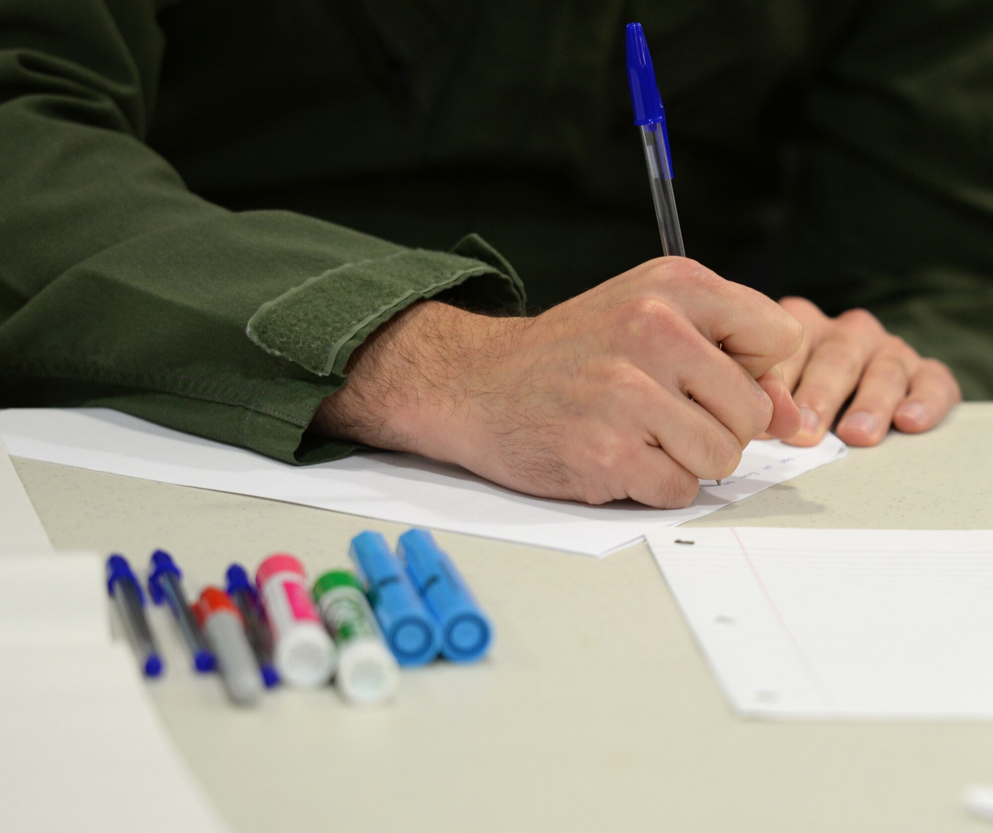U.S. Air Force Tech. Sgt. William Skinkle, 488th Intelligence Squadron NCO in charge of operations training, writes down some ideas from the group during a professional development class Oct. 19, 2016, on RAF Mildenhall, England. Airmen joined the class from across different career fields in order to gain a broad perspective of issues that affect many different areas of the Air Force. (U.S. Air Force photo by Gina Randall)