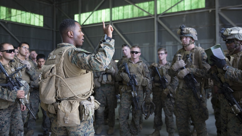 First Lieutenant Khalif I. Yisrael, a platoon commander assigned to Special Purpose Marine Air Ground Task Force-Crisis Response-Africa, briefs the scheme of maneuver during an alert force drill at Air Base Morón, Spain, Oct. 20, 2016. The purpose of the drill was to rehearse and assess the SPMAGTF’s ability to integrate elements and respond to a time-sensitive crisis. SPMAGTF-CR-AF is designed to provide contingency support to U.S. Africa Command, including tactical recovery of aircraft and personnel, embassy reinforcement, support to noncombatant evacuation operations, humanitarian assistance and disaster relief. 