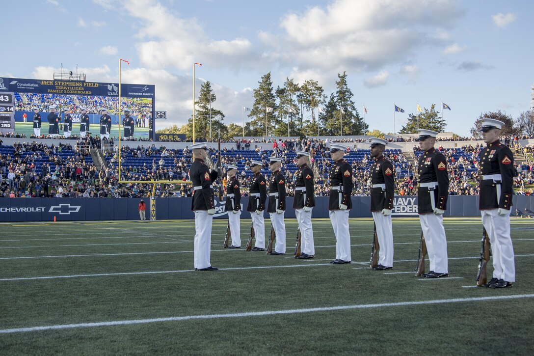 The United States Marine Corps Silent Drill Platoon performs during the halftime show for the Navy vs. Memphis football game at the Navy-Marine Corps Memorial Stadium, Annapolis, Md., October 22, 2016. The Silent Drill Platoon performs at events across the country, showing spectators the discipline, precision and professionalism all Marines embody. (Official Marine Corps photo by Lance Cpl. Robert Knapp/Released)