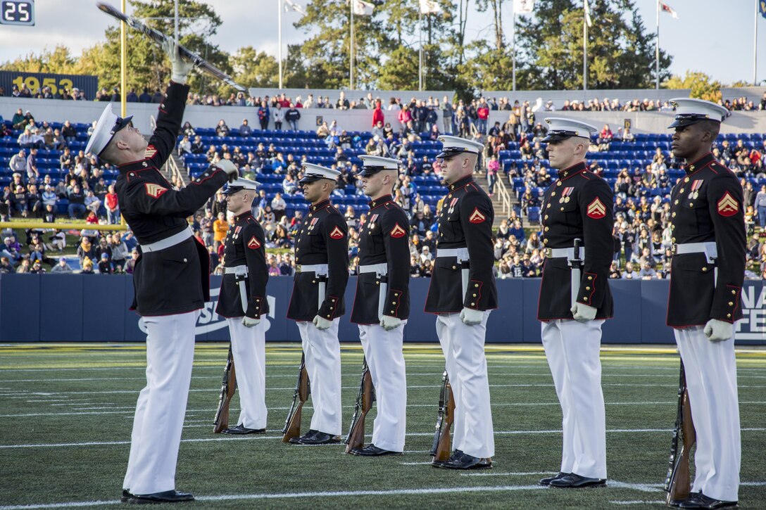 The United States Marine Corps Silent Drill Platoon performs during the halftime show for the Navy vs. Memphis football game at the Navy-Marine Corps Memorial Stadium, Annapolis, Md., October 22, 2016. The Silent Drill Platoon performs at events across the country, showing spectators the discipline, precision and professionalism all Marines embody. (Official Marine Corps photo by Lance Cpl. Robert Knapp/Released)