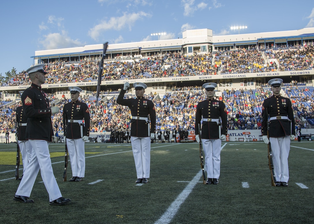 The United States Marine Corps Silent Drill Platoon performs during the halftime show for the Navy vs. Memphis football game at the Navy-Marine Corps Memorial Stadium, Annapolis, Md., October 22, 2016. The Silent Drill Platoon performs at events across the country, showing spectators the discipline, precision and professionalism all Marines embody. (Official Marine Corps photo by Lance Cpl. Robert Knapp/Released)