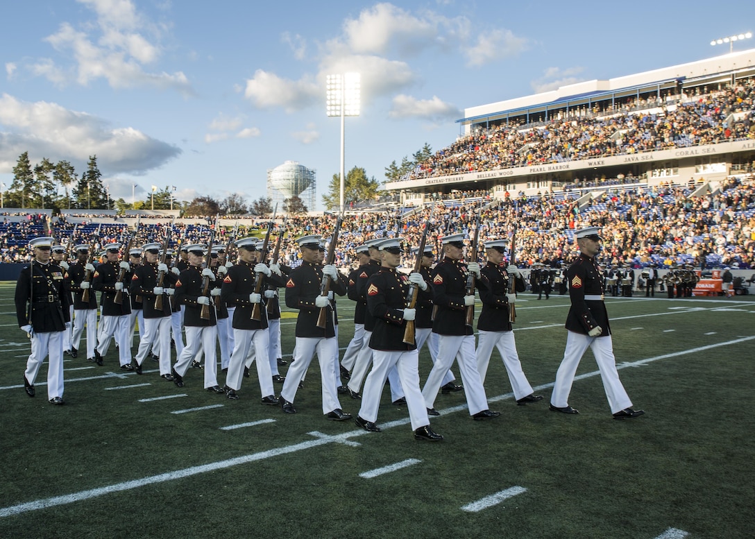 The United States Marine Corps Silent Drill Platoon performs during the halftime show for the Navy vs. Memphis football game at the Navy-Marine Corps Memorial Stadium, Annapolis, Md., October 22, 2016. The Silent Drill Platoon performs at events across the country, showing spectators the discipline, precision and professionalism all Marines embody. (Official Marine Corps photo by Lance Cpl. Robert Knapp/Released)