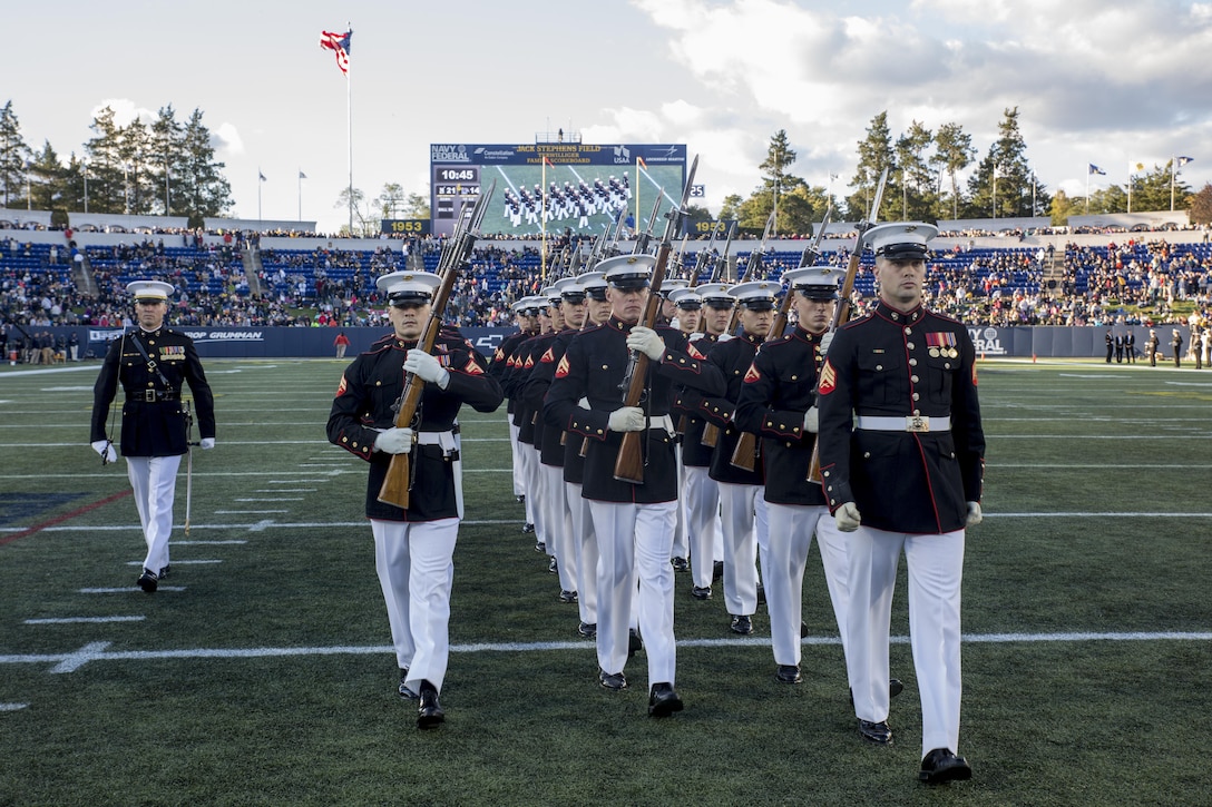 The United States Marine Corps Silent Drill Platoon performs during the halftime show for the Navy vs. Memphis football game at the Navy-Marine Corps Memorial Stadium, Annapolis, Md., October 22, 2016. The Silent Drill Platoon performs at events across the country, showing spectators the discipline, precision and professionalism all Marines embody. (Official Marine Corps photo by Lance Cpl. Robert Knapp/Released)