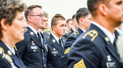 Members of the 455th Engineer Company and the 659th Engineer Company attend the memorialization ceremony of the Cpl. Kelly B. Grothe Army Reserve Center in Hayden, Idaho, Oct. 22. Grothe was a United States Army Combat Engineer assigned to Bravo Company, 321st Engineer Battalion, who was killed in action while conducting route clearance operations in the area of Abu Bali, Iraq during the Global War on Terrorism, May 3, 2007. He was 21 years old.