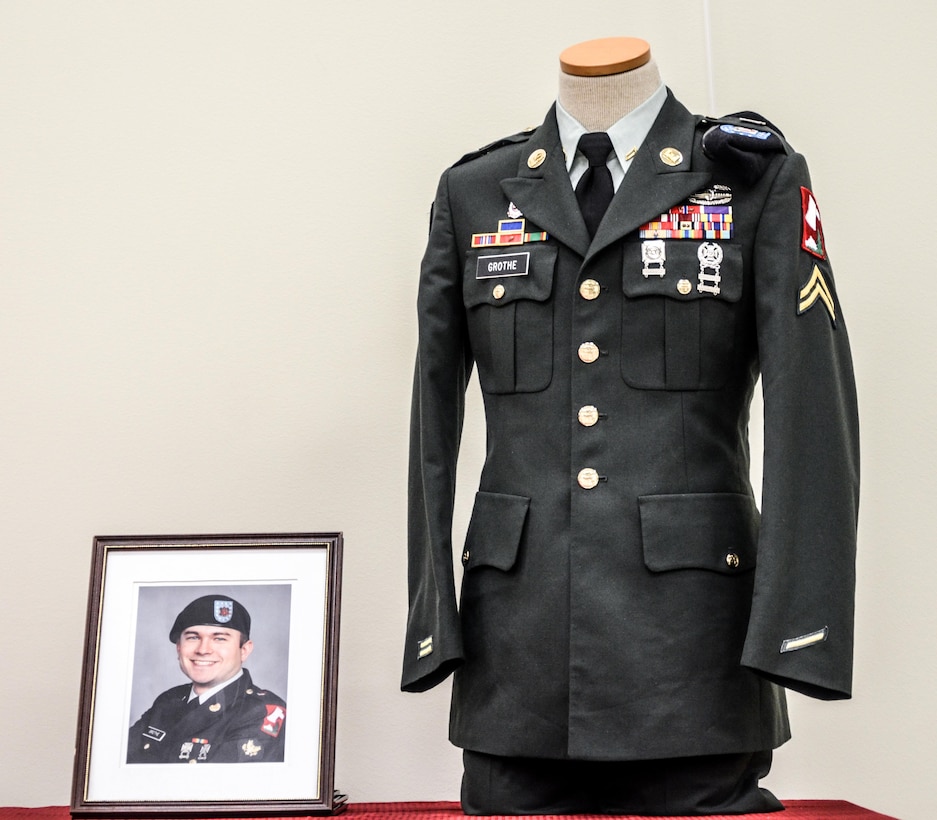 Cpl. Kelly Grothe’s uniform and photograph are displayed during the memorialization ceremony of the Cpl. Kelly B. Grothe Army Reserve Center in Hayden, Idaho, Oct. 22. Grothe was a United States Army Combat Engineer assigned to Bravo Company, 321st Engineer Battalion, who was killed in action while conducting route clearance operations in the area of Abu Bali, Iraq during the Global War on Terrorism, May 3, 2007. He was 21 years old.