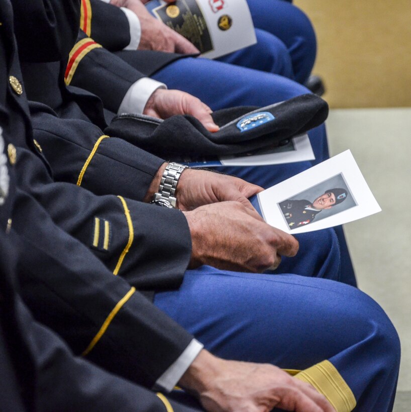 Members of the 455th Engineer Company and the 659th Engineer Company reflect quietly during the memorialization ceremony of the Cpl. Kelly B. Grothe Army Reserve Center in Hayden, Idaho, Oct. 22. Grothe was a United States Army Combat Engineer assigned to Bravo Company, 321st Engineer Battalion, who was killed in action while conducting route clearance operations in the area of Abu Bali, Iraq during the Global War on Terrorism, May 3, 2007. He was 21 years old.