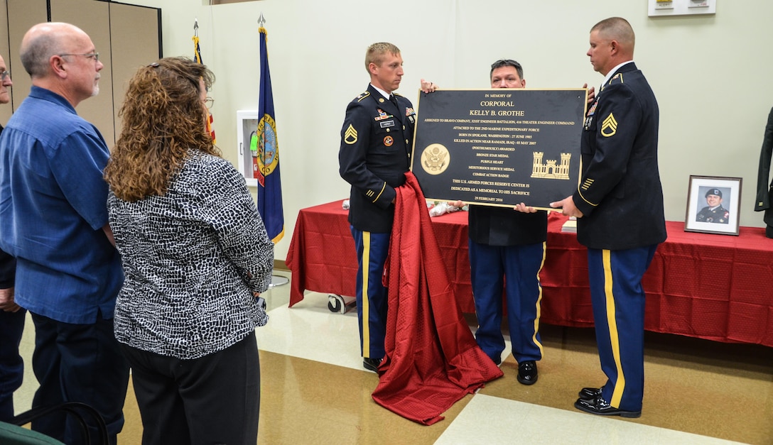 Jan and Brian Grothe, Cpl. Kelley Grothe’s parents, watch as the plaque is unveiled during the memorialization ceremony of the Cpl. Kelly B. Grothe Army Reserve Center in Hayden, Idaho, Oct. 22. Grothe was a United States Army Combat Engineer assigned to Bravo Company, 321st Engineer Battalion, who was killed in action while conducting route clearance operations in the area of Abu Bali, Iraq during the Global War on Terrorism, May 3, 2007. He was 21 years old.