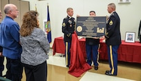 Jan and Brian Grothe, Cpl. Kelley Grothe’s parents, watch as the plaque is unveiled during the memorialization ceremony of the Cpl. Kelly B. Grothe Army Reserve Center in Hayden, Idaho, Oct. 22. Grothe was a United States Army Combat Engineer assigned to Bravo Company, 321st Engineer Battalion, who was killed in action while conducting route clearance operations in the area of Abu Bali, Iraq during the Global War on Terrorism, May 3, 2007. He was 21 years old.