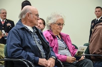 Cpl. Kelly B. Grothe’s grandparents read the dedication program during the memorialization ceremony of the Cpl. Kelly B. Grothe Army Reserve Center in Hayden, Idaho, Oct. 22. Grothe was a United States Army Combat Engineer assigned to Bravo Company, 321st Engineer Battalion, who was killed in action while conducting route clearance operations in the area of Abu Bali, Iraq during the Global War on Terrorism, May 3, 2007. He was 21 years old.