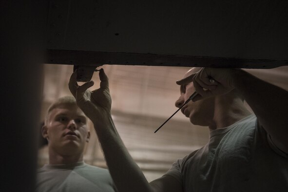 20th Aircraft Maintenance Unit avionics technicians with the 727th Special Operations Aircraft Maintenance Squadron make repairs on a CV-22 Osprey Oct. 18, 2016 at Cannon Air Force Base, N.M. The 20th Aircraft Maintenance Unit is one of many shops at Cannon that operates 24 hours a day, keeping the 27th Special Operations Wing ready, relevant and resilient any time, any place. (U.S. Air Force Photo by Senior Airman Shelby Kay-Fantozzi/released)