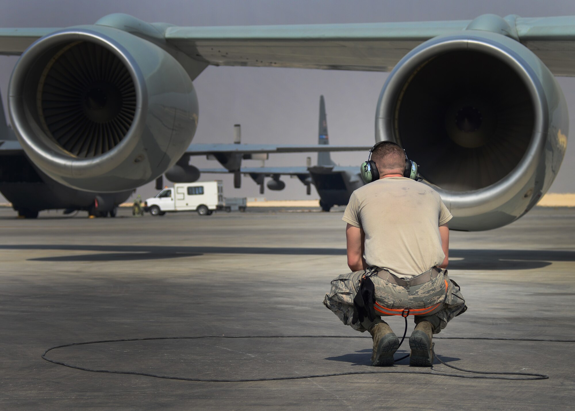 Airman 1st Class Austin Kennedy, 379th Expeditionary Aircraft Maintenance Squadron crew chief, checks the engines on a RC-135 Rivet Joint prior to launch Oct. 21, 2016, at Al Udeid Air Base, Qatar. The RC-135 Rivet Joint is a reconnaissance aircraft that supports theater and national level consumers with near real-time on-scene electronic warfare support, intelligence collection, analysis, and dissemination capabilities. (U.S. Air Force Photo/Senior Airman Miles Wilson/Released)