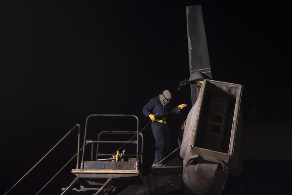 A crew chief with the 20th Aircraft Maintenance Unit, 727th Special Operations Aircraft Maintenance Squadron performs routine maintenance on the engine of a CV-22 Osprey Oct. 18, 2016 at Cannon Air Force Base, N.M. The 20th Aircraft Maintenance Unit is one of many shops at Cannon that operates 24 hours a day, keeping the 27th Special Operations Wing ready, relevant and resilient any time, any place. (U.S. Air Force Photo by Senior Airman Shelby Kay-Fantozzi/released)