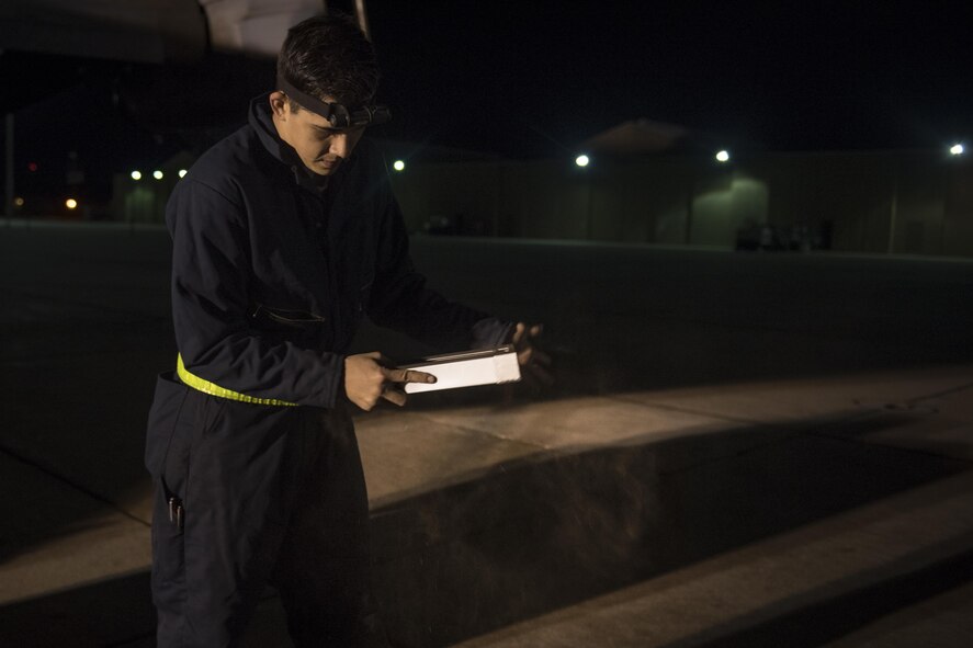 A crew chief with the 20th Aircraft Maintenance Unit, 727th Special Operations Aircraft Maintenance Squadron shakes New Mexico dirt from a CV-22 Osprey’s air filter Oct. 18, 2016 at Cannon Air Force Base, N.M. The 20th Aircraft Maintenance Unit is one of many shops at Cannon that operates 24 hours a day, keeping the 27th Special Operations Wing ready, relevant and resilient any time, any place. (U.S. Air Force Photo by Senior Airman Shelby Kay-Fantozzi/released)