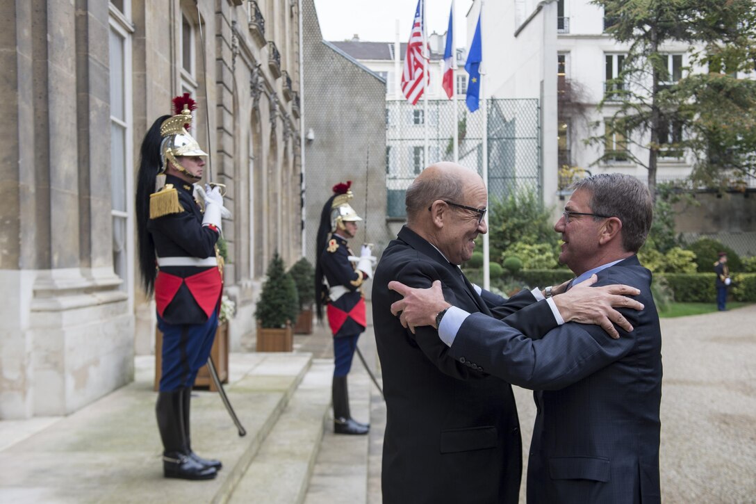 Defense Secretary Ash Carter, right, embraces French Defense Minister Jean-Yves Le Drian in Paris, Oct. 25, 2016, before a meeting. DoD photo by Air Force Tech. Sgt. Brigitte N. Brantley