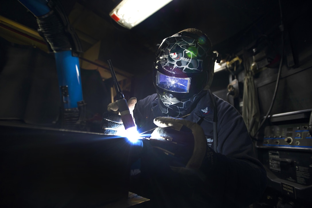 Navy Petty Officer 3rd Class Cullen Kyser welds together a filter housing for a fan coil unit aboard the aircraft carrier USS Dwight D. Eisenhower in the Persian Gulf, Oct. 20, 2016. Kyser is a hull technician. Navy photo by Petty Officer 3rd Class Andrew J. Sneeringer