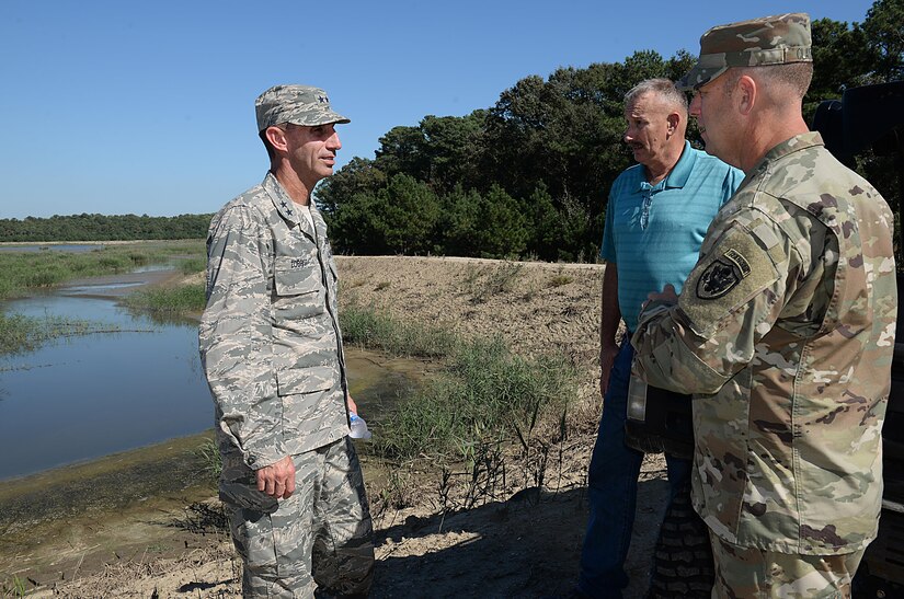 U.S. Air Force Maj. Gen. Scott Zobrist, 9th Air Force commander, views the dredging point with U.S. Army Col. Ralph Clayton, 733rd Mission Support Group commander, and Jay Dehart, 733rd MSG harbormaster, at Joint Base Langley-Eustis, Va., Oct. 18, 2016. Zobrist spent three days visiting numerous organizations to learn how operations work on the joint installation and to better understand funding and manning needs. (U.S. Air Force photo by Staff Sgt. Teresa J. Cleveland)