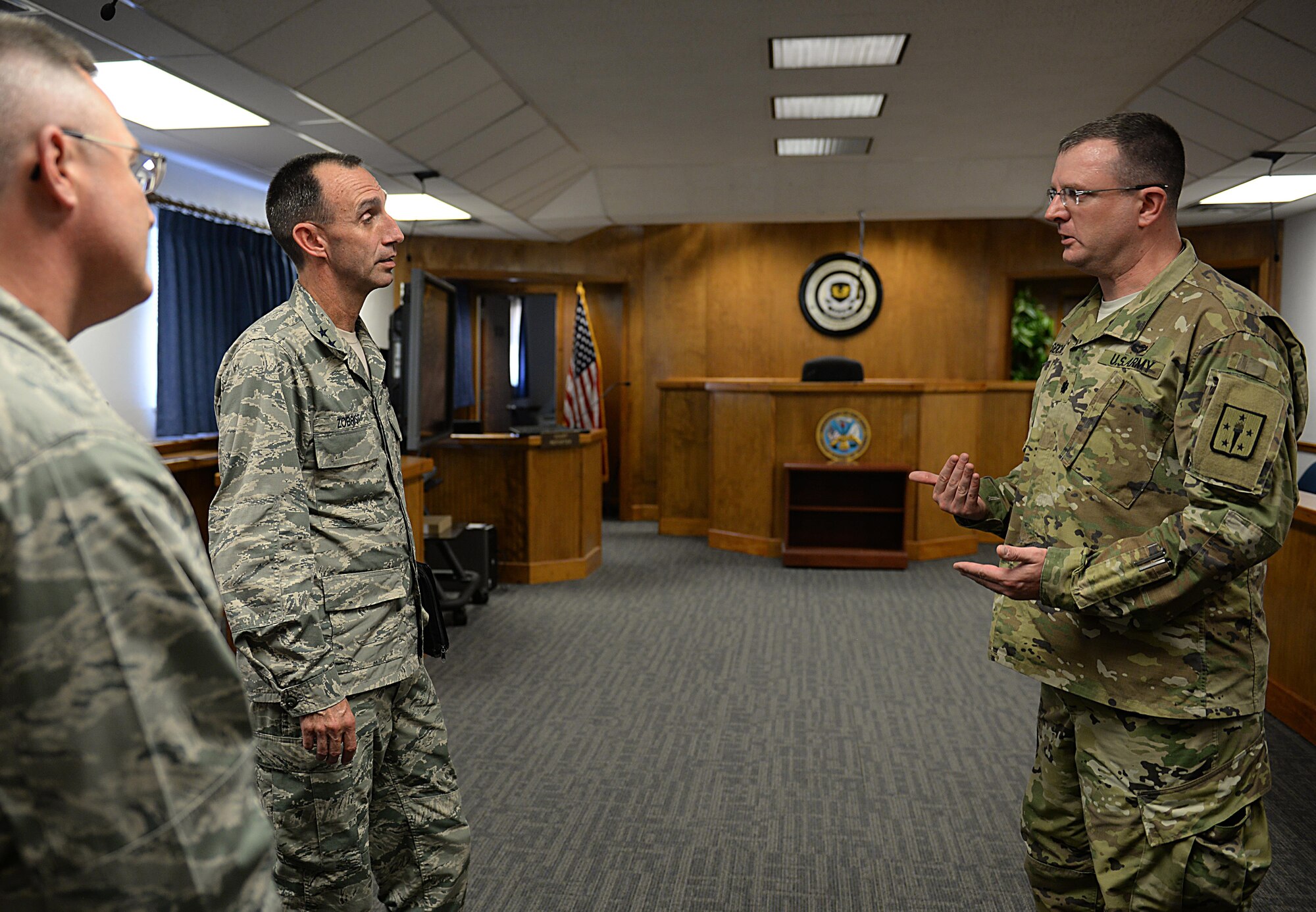 U.S. Air Force Maj. Gen. Scott Zobrist, 9th Air Force commander, asks U.S. Army Lt. Col. Christian Diechert, Command Arms Support Command command judge advocate, questions regarding joint base missions and capabilities in the newly renovated court room at Joint Base Langley-Eustis, Va., Oct. 18, 2016. Zobrist toured facilities on JBLE to gain knowledge on JBLE’s missions, goals, needs and obstacles. (U.S. Air Force photo by Staff Sgt. Teresa J. Cleveland) 