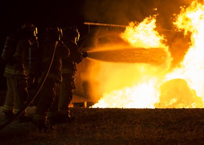 Firefighters from Joint Base San Antonio-Randolph Fire Emergency Services extinguish an aircraft engine fire Oct. 17 at the Camp Talon fire training grounds on JBSA-Randolph. Although aircraft fires are rare at JBSA locations, engaging in ARFF – aircraft rescue and firefighting – training gives firefighters the ability to successfully contain and extinguish blazes should they occur on or off base.