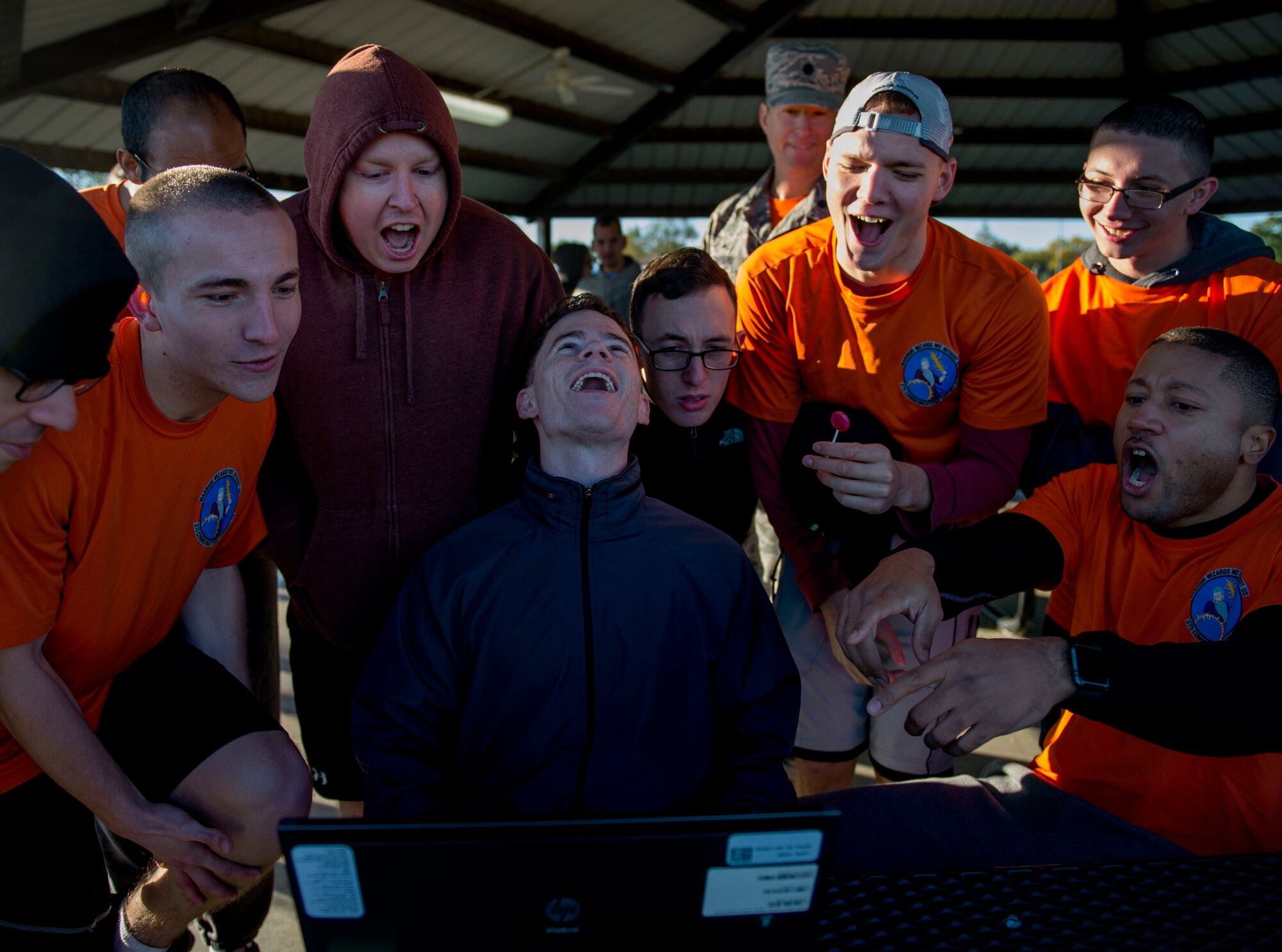 The 375th Communications Support Squadron roars as they try to figure out a cyber challenge, Scott Air Force Base, Ill., Oct. 21, 2016. The 375th Communications Group hosted its first ever Communication Fitness Challenge, where cyber units on Scott Air Force Base competed against each other in various challenges to test their knowledge of communications, Oct. 21, 2016. The 38th Cyberspace Squadron, 835th Cyberspace Operations Squadron, Air Force Network Integration Center, Cyberspace Support Squadron, Transportation Command, 375th Communications Squadron, 375th Communications Support Squadron, and Defense Information Systems Agency took part in the five-phase challenge, which included a capture the flag, ultimate Frisbee, and numerous mental contests.   DISA took first place, 375th CS took second, and 375th CSPTS took third. (U.S. Air Force photo by Staff Sgt. Jodi Martinez)