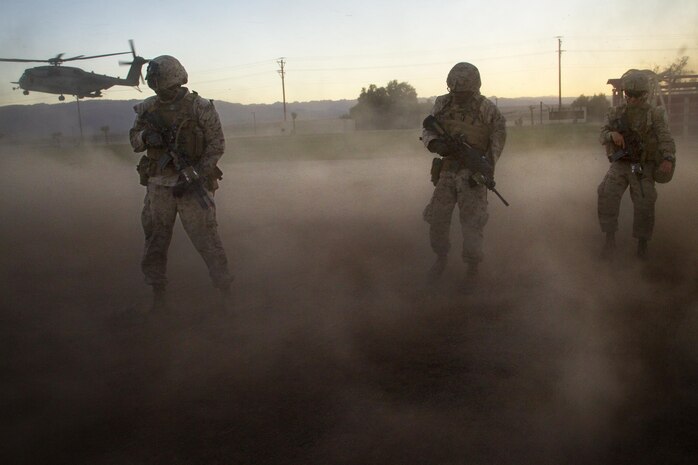 Marines with 2nd Battalion, 3rd Marine Regiment, exit a landing zone during a Non-combatant Evacuation Operation exercise aboard Marine Corps Air Ground Combat Center, Twentynine Palms, Calif., Oct. 14, 2016. (Official Marine Corps photo by Cpl. Connor Hancock/Released)