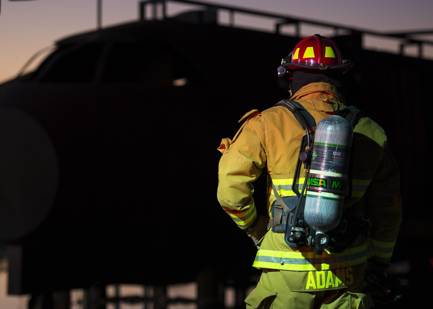 Alan Adams, Joint Base San Antonio-Randolph Fire Emergency Services lead firefighter, prepares to conduct aircraft rescue and firefighting, or ARFF, night fire training at the Camp Talon fire training grounds on JBSA-Randolph Oct. 17, 2016. Live fire training is required on a recurring basis and the JBSA-Randolph Fire Departments aims to conduct the training at least once every six months. 