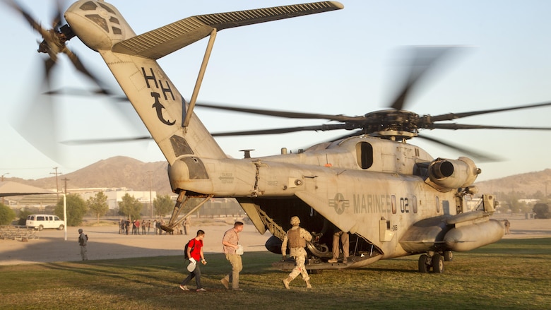 Marines with 2nd Battalion, 3rd Marine Regiment, escort simulated evacuees into a CH-53 “Super Stallion” landing zone during a Non-combatant Evacuation Operation exercise aboard Marine Corps Air Ground Combat Center, Twentynine Palms, Calif., Oct. 14, 2016. (Official Marine Corps photo by Cpl. Connor Hancock/Released)
